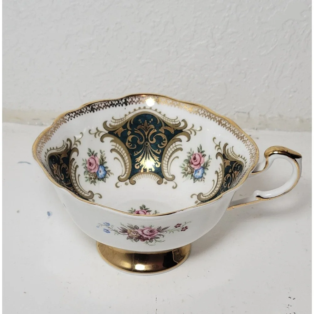 Paragon teacup - dark green panels on white background with floral‎ decor...Read